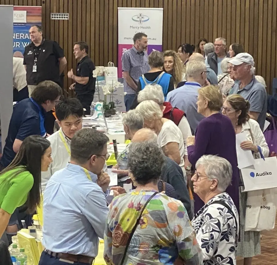 Visitors enjoying friendly conversations at a Senior Expo